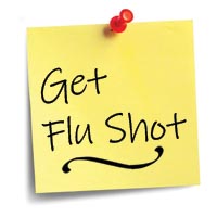 Sticky note with flu shot reminder