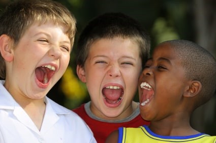 photo of three boys singing