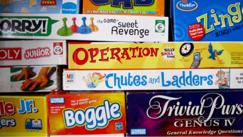 stack of board game boxes