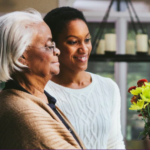 Two women, one is elderly and the other is a younger woman.