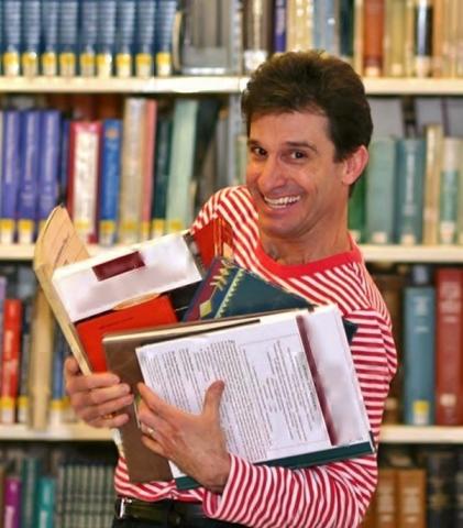 Juggler holding books