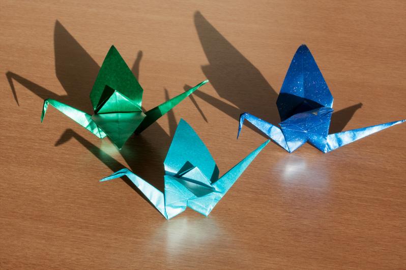 Three small origami swans